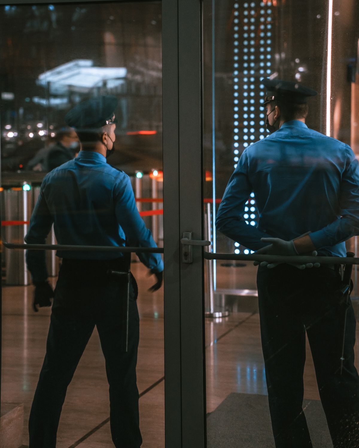 JT Security guards on duty at a building entrance