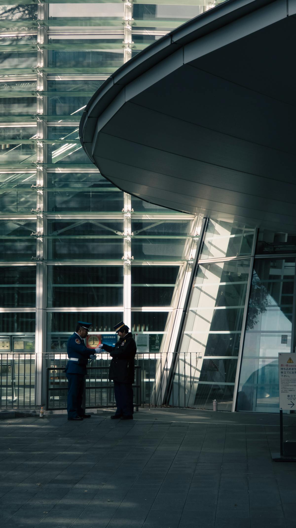 Uniformed security guards stationed at a modern corporate building